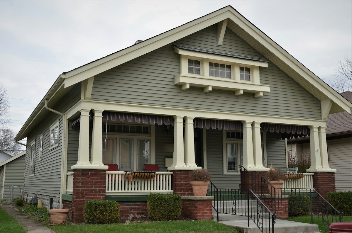 A Craftsman bungalow with a deep porch on brick piers